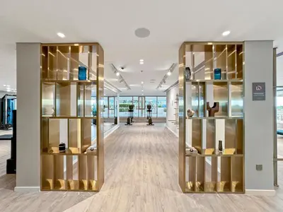 a hallway with glass shelves in a building at Coastal Elegance 1-Bedroom in Grand Bleu in Dubai