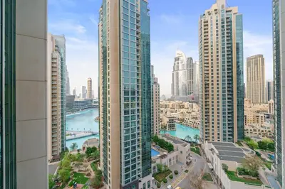 a view of a city skyline with tall buildings at 2BR in Downtown with Burj Khalifa & Fountain views in Dubai