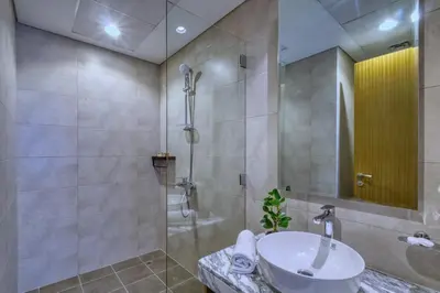 a bathroom with a sink and a shower at GuestReady - Elegant city escape in Business Bay in Dubai