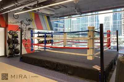 a boxing ring in a room with at Mira Holiday Homes - Newly and modern 1 bedroom with lake view in JLT in Dubai