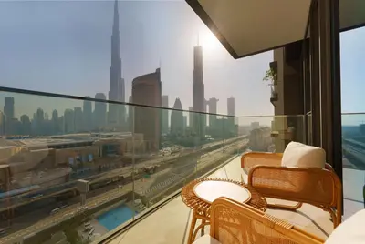 a balcony with a view of a city skyline at Elite Escape - 3 BHK Burj View & Dubai Mall Access in Dubai