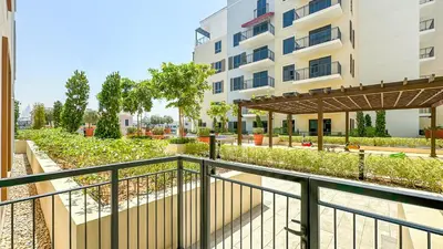 a balcony of a building with a garden at Peaceful 1BR in La Serine, Lush Garden Views - 1AB02 in Dubai