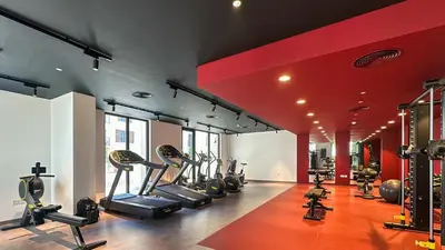 a gym with treadmills and elliptical machines at Peaceful 1BR in La Serine, Lush Garden Views - 1AB02 in Dubai