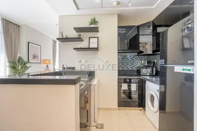a kitchen with a sink and a dishwasher at Sea and City View 1BR, Close to Marina Beach, Botanica Tower, Dubai Marina by Deluxe Holiday Homes in Dubai
