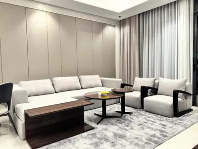 a living room with a couch and a table at CaiCai Homes 1 BHK Nobles Tower Business Bay 5 min Drive to Dubai Mall in Dubai