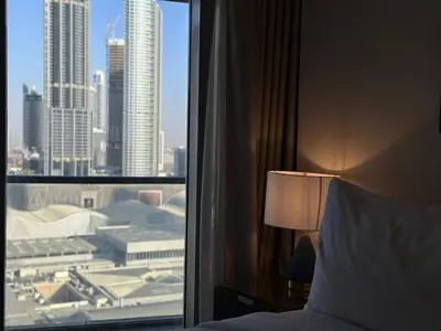 a bedroom with a view of a city from a window at Durrani Homes - Dubai Mall Fashion Avenue in Dubai