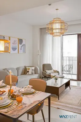 a living room with a couch and a table at Serene 1 BR in Surf 2-Creek Beach Access in Dubai