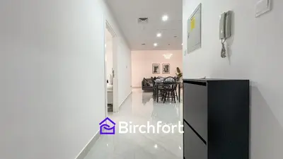 a view of a kitchen and dining room in a house at Stylish Stay Steps from the Marina in Dubai