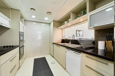 a kitchen with a sink and a stove at 2BR at Lofts West Near Dubai Mall and Burj Khalifa in Dubai