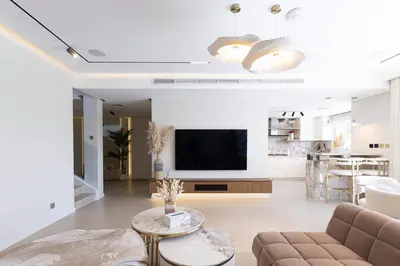 a living room with a couch and a tv at Villa Zalex Springs 14 Luxury Living with Private Pool in Dubai
