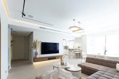 a living room with a couch and a tv at Villa Zalex Springs 14 Luxury Living with Private Pool in Dubai