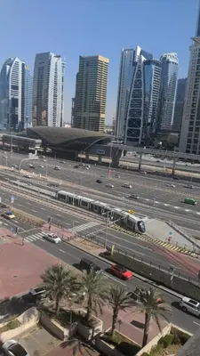 a large parking lot with a train in a city at 2BHK Garden Apartment at the heart of Dubai Marina in Dubai