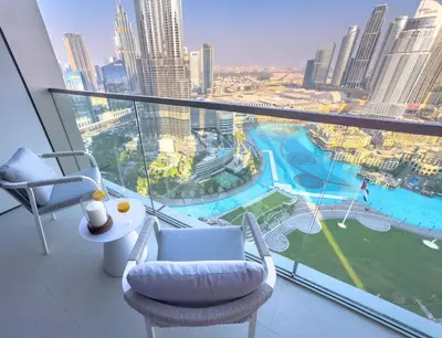 a room with a view of a city from a building at GRANDE SIGNATURE with a direct Burj Khalifa view and Private Fountain Show at high floor with DXB AIRPORT VIP Shuttle option for 6 guests in Dubai