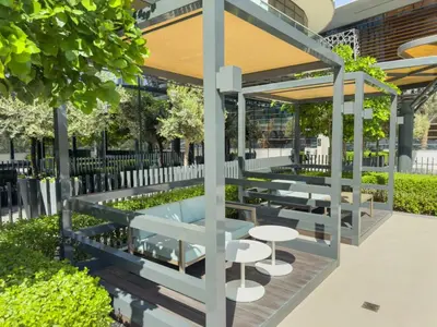 a pavilion with tables and chairs in a park at GRANDE SIGNATURE with a direct Burj Khalifa view and Private Fountain Show at high floor with DXB AIRPORT VIP Shuttle option for 6 guests in Dubai