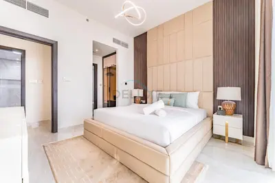 a bedroom with a large white bed in a room at City Views 2BR and Assistant Room with Mini Private Pool in Balcony, Gemz by Danube, Al Furjan by Deluxe Holiday Homes in Dubai