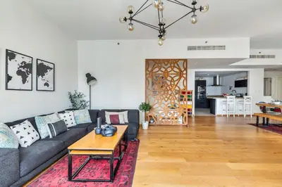 a living room with a couch and a table at The Smart Concierge - Rimal 4 in Dubai