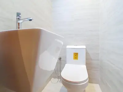 a bathroom with a toilet and a sink at Vacationer I Premium 1 Bed I Dubai Marina Living & Metro Nearby I Dream Tower in Dubai