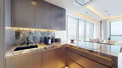 a kitchen with a sink and a counter top at Palm Tower - Luxurious One Bed with Palm View in Dubai