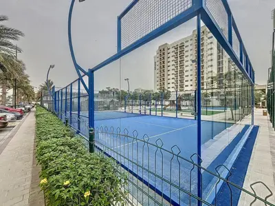 a tennis court on the side of a building at UNA Tower - Peaceful One Bedroom in Townsquare in Dubai