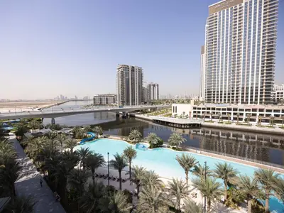 an aerial view of a resort with palm trees and buildings at Beach View family friendly unit in Dubai in Dubai