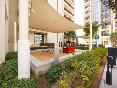a park with a playground in a building at Beach View family friendly unit in Dubai in Dubai