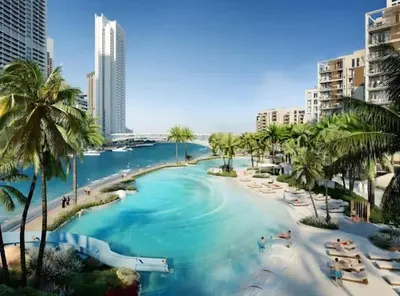 a river in the middle of a city with palm trees at Stylish 1BR City View at Vida Creek Beach in Dubai