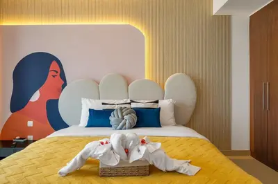 a bedroom with a large bed with a large headboard at Trendy 1BR Dubai Dream with full BurjViews Above Dubai Mall in Dubai