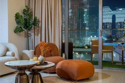 a living room with a view of a city at Trendy 1BR Dubai Dream with full BurjViews Above Dubai Mall in Dubai