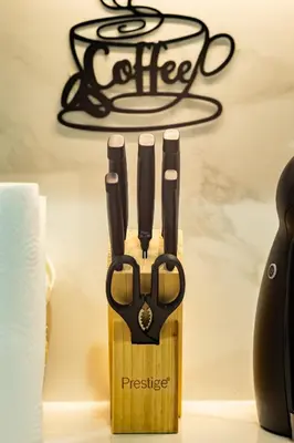 a knife block with three pairs of scissors at Modern Elegance in a Cosy Retreat with Balcony - Azizi Riviera in Dubai
