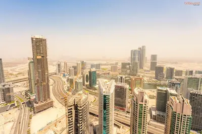 an aerial view of a city with tall buildings at Bnbeyond's Sky-High Luxe with Above and Beyond Views in Dubai