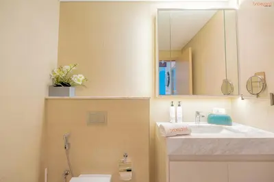 a bathroom with a sink and a mirror at Bnbeyond's Sky-High Luxe with Above and Beyond Views in Dubai