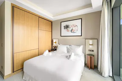 a bedroom with a large white bed in a room at Address Residence Dubai Opera 34 by Luxstay Holiday Homes in Dubai