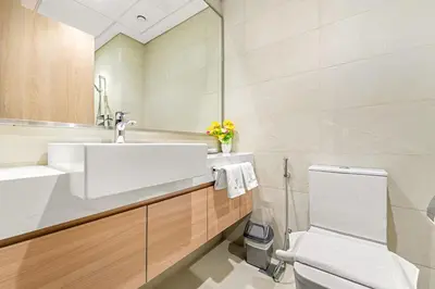 a bathroom with a sink and a toilet at FIRST CLASS Studio Modern Vibes in Dubai in Dubai