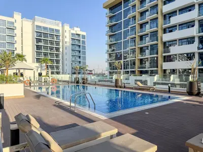 a swimming pool in the middle of a building at FIRST CLASS Studio Modern Vibes in Dubai in Dubai