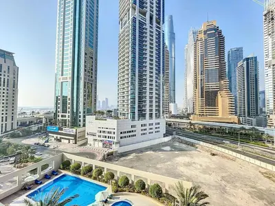 a view of a city skyline with a swimming pool at Royal Oceanic - Bright Two Bed on the 14th Floor in Dubai