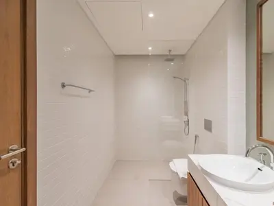 a white bathroom with a sink and a toilet at TRPS - Central Park, City Walk, Al Wasl - 2BR Modern Residence - Elegantly Furnished to High Standards in Dubai