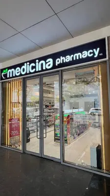 a store with a medicine pharmacy sign in a store at Downtown Apt - Near Burj Khalifa - Free Parking in Dubai