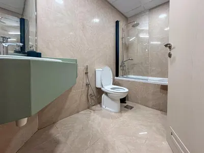 a bathroom with a toilet and a shower at DreamShoma-Sea View 2BR Pool Gym in Dubai