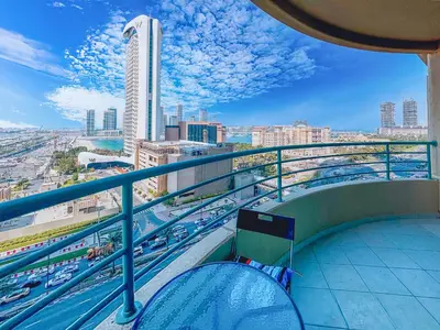 a balcony with a view of a city at DreamShoma-Sea View 2BR Pool Gym in Dubai