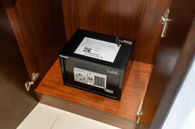 a box sitting on top of a wooden table at 29 Boulevard by EMAAR 1BR 4min Walk to the Burj and Dubai Mall in Dubai