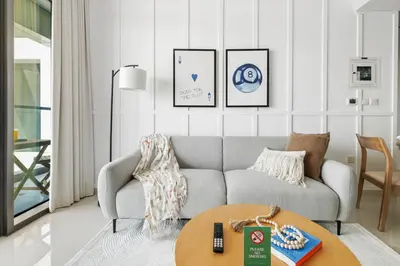 a living room with a couch and a table at Sky High 1BR in City View with 41st Floor Views in Dubai