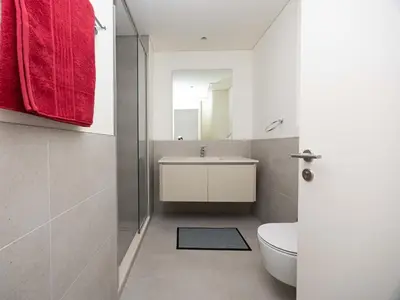 a bathroom with a sink and a toilet and a mirror at Beach Access, Burj Khalifa View, Family Friendly in Dubai