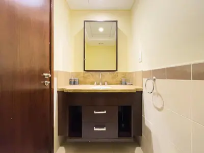 a bathroom with a sink and a mirror at Golden Homes 29 blvd tower Urban nest 1BR Near Dubai mall & burj khalifa downtown dubai in Dubai