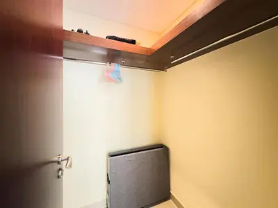 a tv sitting in a room with a wall at Golden Homes 29 blvd tower Urban nest 1BR Near Dubai mall & burj khalifa downtown dubai in Dubai