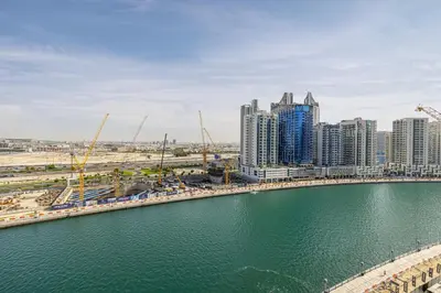a city with tall buildings and a body of water at Daniels Studio with Canal View at Marasi Drive in Dubai