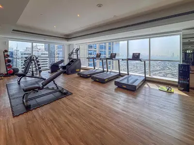 an apartment gym with a view of the city at Frank Porter - Saba 3 in Dubai