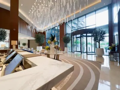 a large lobby with a chandelier in a building at ADDRESS Residences Dubai Opera at Downtown in Dubai