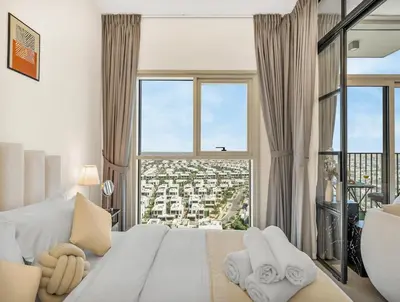 a bedroom with a large bed with a large window at Luxury 1-BR Escape in Dubai Hills Collective , 5 min from Mall in Dubai