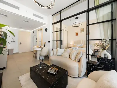 a living room with a couch and a table at Luxury 1-BR Escape in Dubai Hills Collective , 5 min from Mall in Dubai