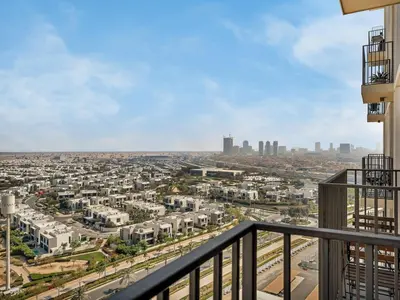 a view of the city from the balcony of a building at Luxury 1-BR Escape in Dubai Hills Collective , 5 min from Mall in Dubai